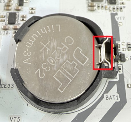 Push the latch to the side to release the battery.